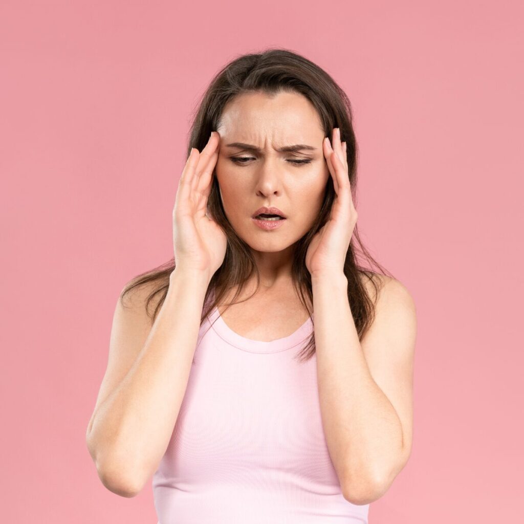 Woman having a headache.