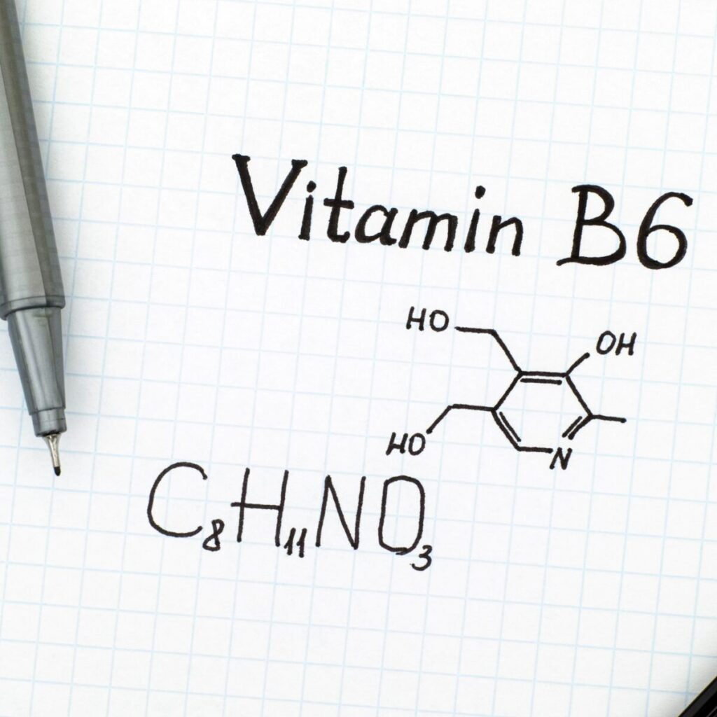 Vitamin b6 formula written on a paper with pen.