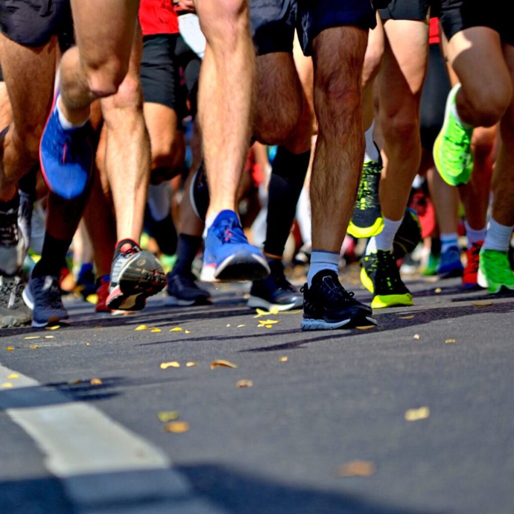 Close up shot of marathon runners.