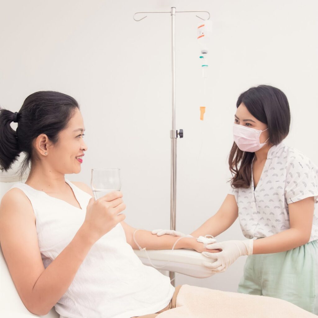 Woman receiving IV vitamin therapy. 