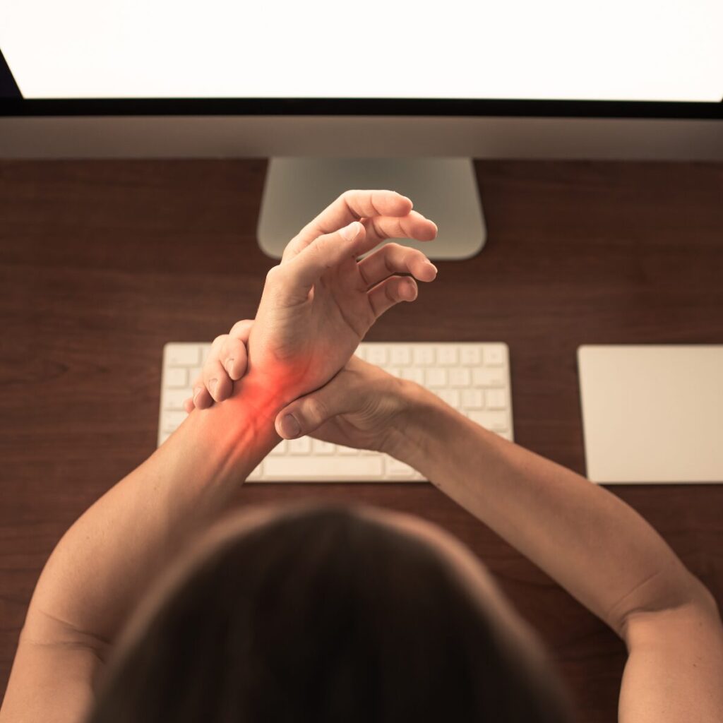 Woman experiencing pain from Carpal Tunnel Syndrome.