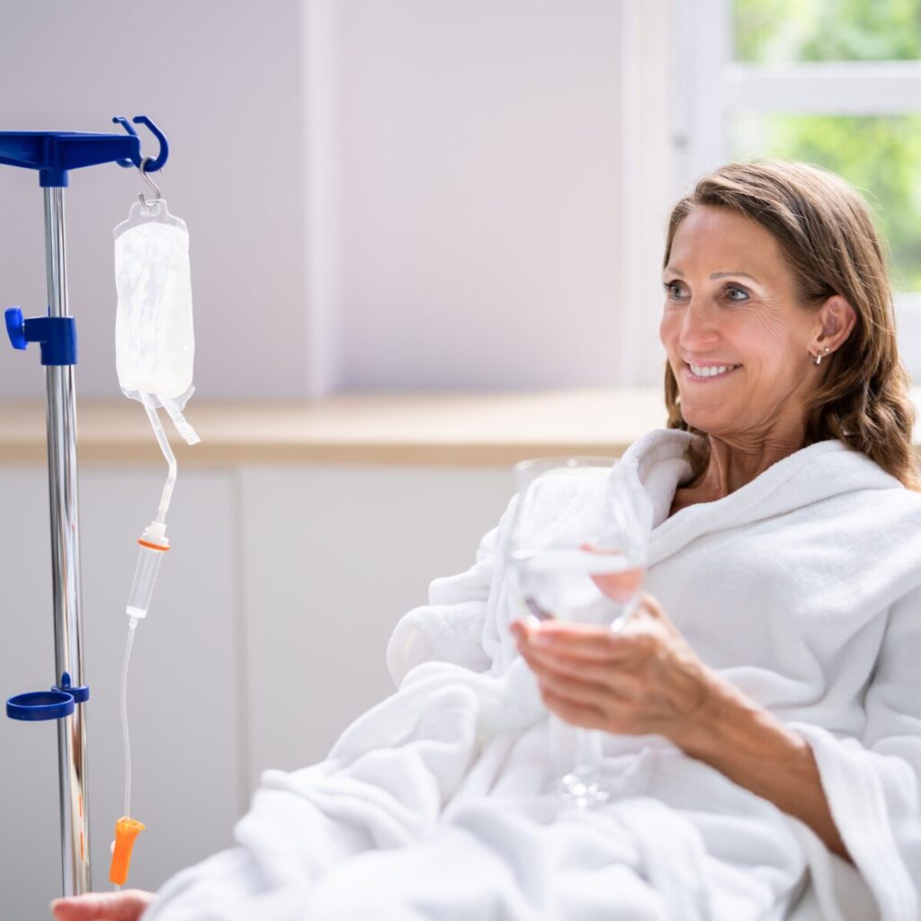 Woman receiving IV treatment at a spa.