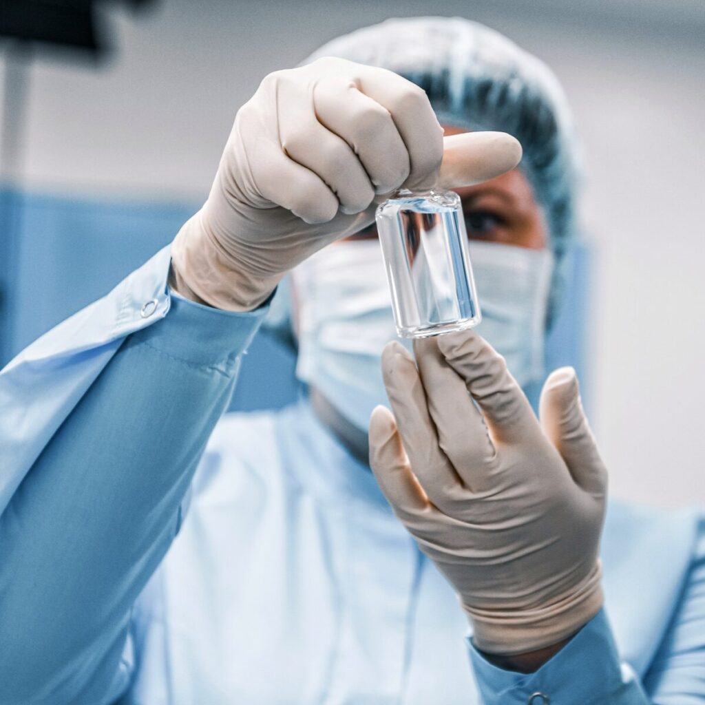 Doctor holding a vial.