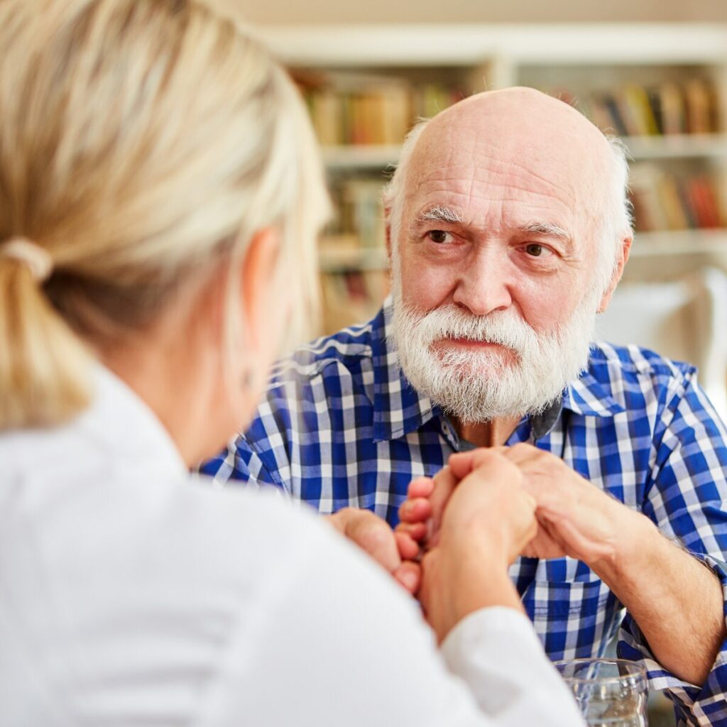 Elderly man getting consultation from doctor.